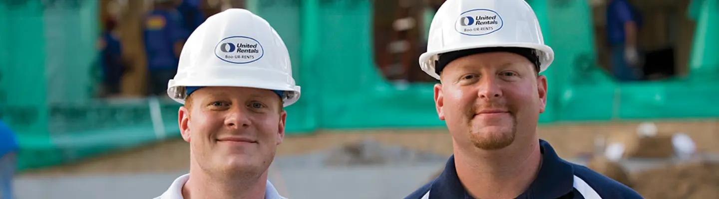 two men in hard hats on construction site