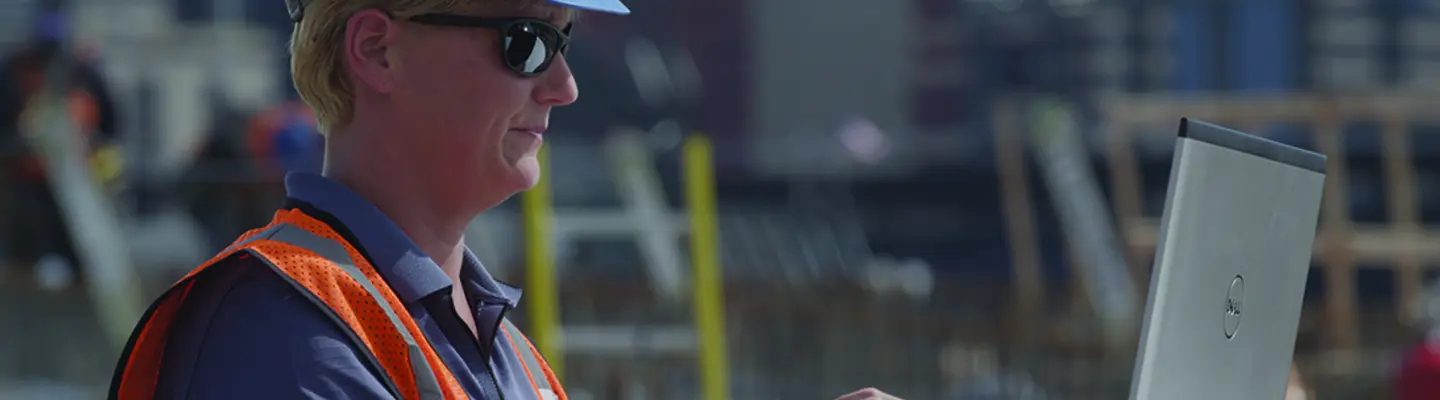 woman on jobsite with laptop