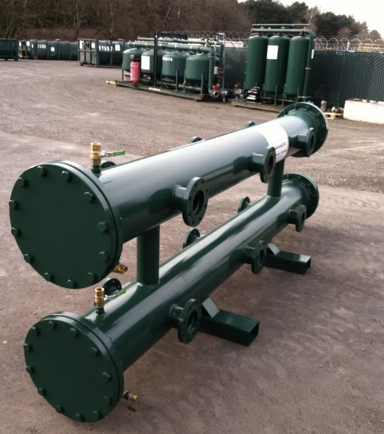 green custom manifold with tanks in the background