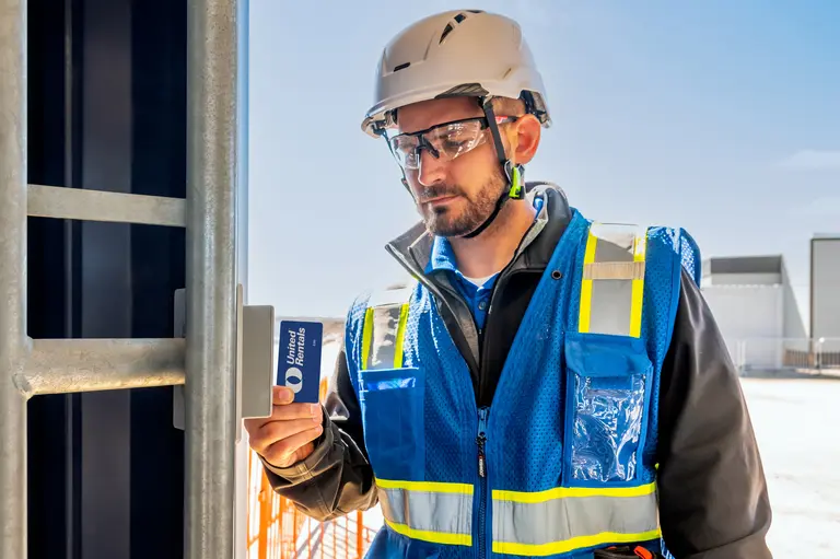 man on jobsite with turnstiles 