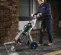Green and silver MAKINEX Demolition Hammer Tile Stripping Cart, 35 lb. Weight Class