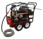 Black and red Mi-T-M 5,000 psi pressure washer being used to wash a piece of heavy machinery