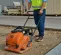 Orange Multiquip Mikasa vibratory plate compactor