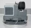 Gray Nilfisk ride-on scrubber