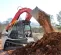 Red Takeuchi Compact Track Loader