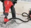 Red and black HILTI Demolition Breaker Jack Hammer Kit, Electric-powered, 35 lbs.