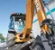 Orange and gray Case Backhoe Loader with 15 foot Dig Depth