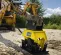 Yellow and black Epiroc Vibratory Plate Compactor Attachment for Backhoe