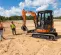 Orange, gray and black HITACHI 7,000-10,000 lb. Mini Excavator, Zero Tail Swing