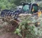 Gray Paladin Root Grapple Bucket Attachment on a Skid Steer