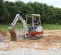 Red, white and gray TAKEUCHI 3,000-3,999 lb. Mini Excavator, Zero Tail Swing