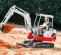 White, red and gray TAKEUCHI 4,000-5,000 lb. Mini Excavator, Zero Tail Swing