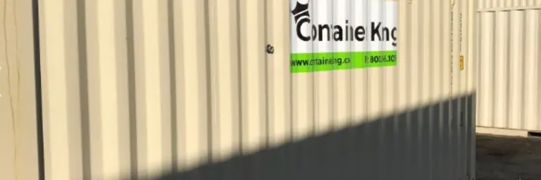 beige shipping container under blue sky