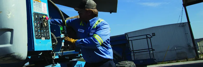 Man Working On Equipment