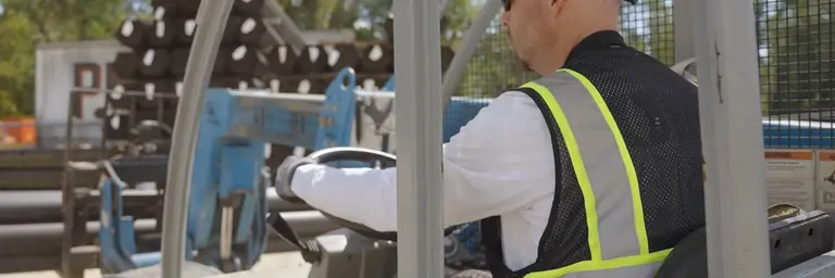 Worker using equipment at a jobsite