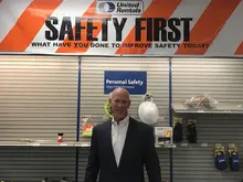Kelly French (employee) in front of safety wall