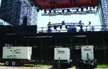 generators behind outdoor stage