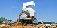 dump truck with big number five on jobsite