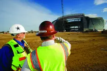 two men in hard hats on construction site