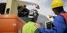 two men walking in ppe on construction site