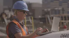 woman on jobsite with laptop