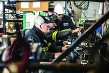 men in shop at united rentals