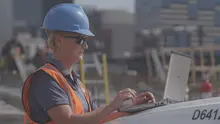 construction manager at computer
