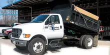 white dump truck unloading