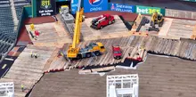 Timber mat supporting a crane at a jobsite